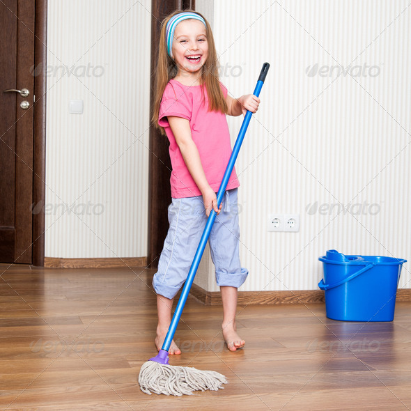 little girl washing the floor