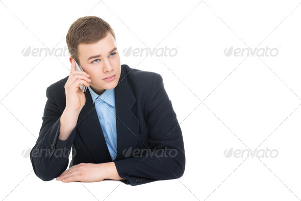 Young businessman speaking on smartphone - Stock Photo - Images