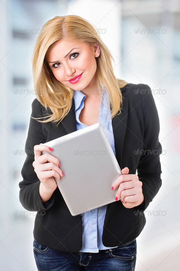 Happy young woman with digital tablet - Stock Photo - Images