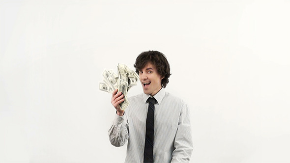 Businessman Throws a Pack of Dollars in the Air Businessman Throws a Pack of Dollars in the Air
