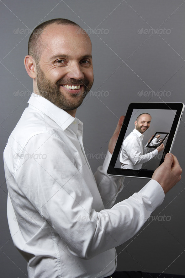 A Friendly Gentleman holdling Digital Tablet