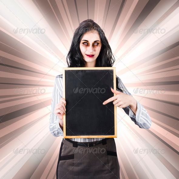 Sinister school teacher holding empty chalk board