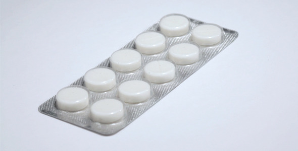 White Pills in Dosage Spinning White Pills in Dosage Spinning