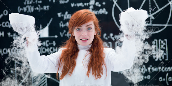 pretty girl conducting a gas lab experiment - Stock Photo - Images
