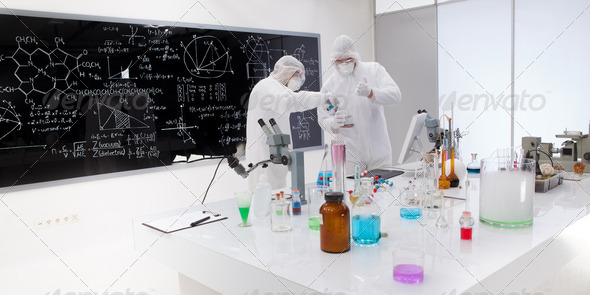 two people working in a chemistry lab - Stock Photo - Images