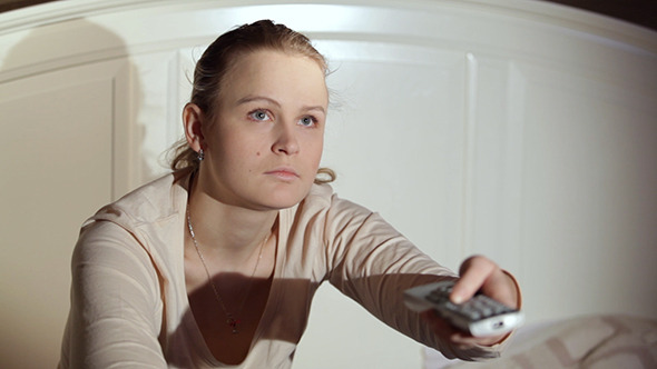 Woman Changing TV Channels Woman Changing TV Channels