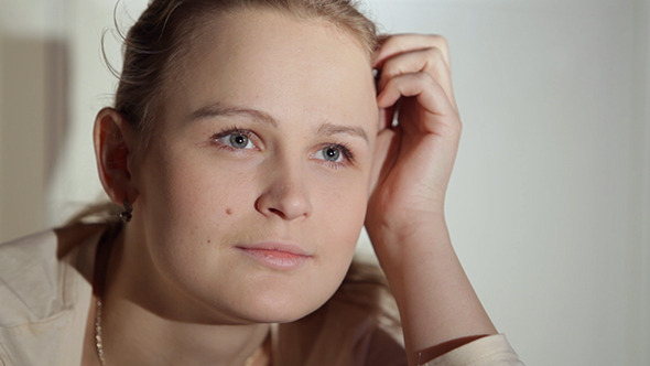 Young Woman Watching An Interesting Film On TV Young Woman Watching An Interesting Film On TV