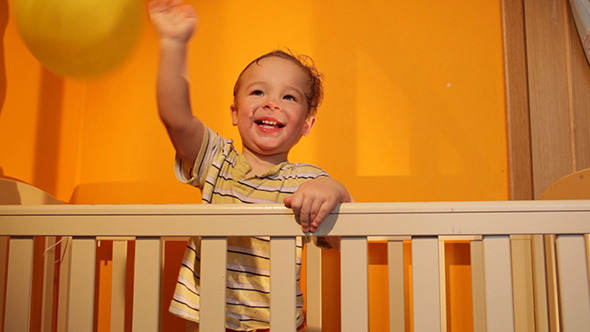 Boy Plays With Balloon In The Playpen Boy Plays With Balloon In The Playpen