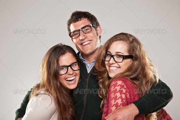 Three smart student friends looking with eyeglasses