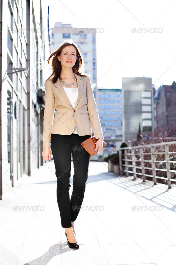 Businesswoman walking outdoors