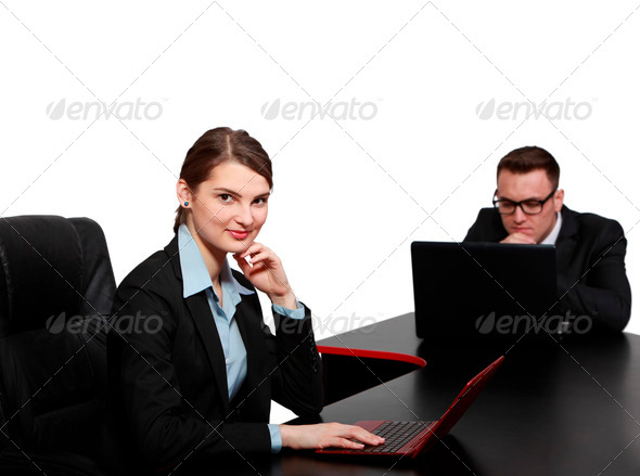 Young Business Couple on Laptops - Stock Photo - Images