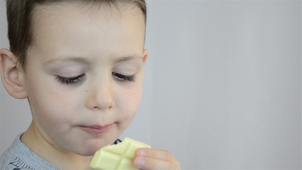 Child Eating White Chocolate 01 Child Eating White Chocolate 01