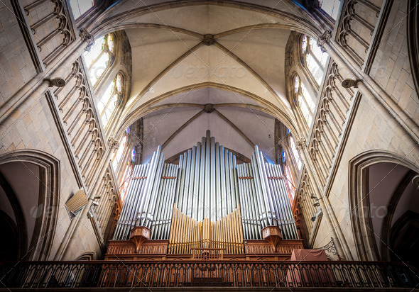 Great organ under arch in catholic church.