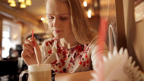Girl Enjoying Coffee Latte In Cafe Girl Enjoying Coffee Latte In Cafe