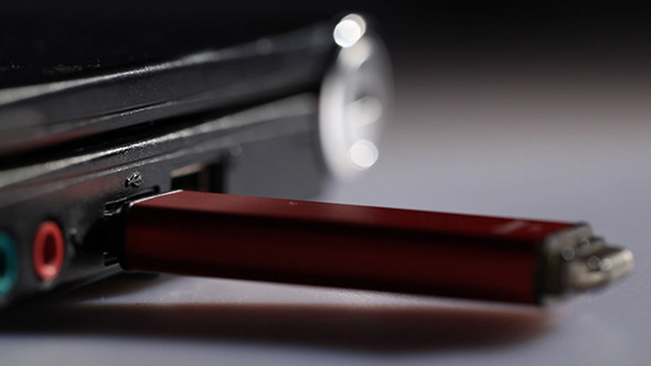 Inserting Red USB Flash Drive In Notebook Inserting Red USB Flash Drive In Notebook