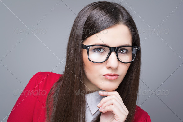 Confident businesswoman wearing glasses - Stock Photo - Images