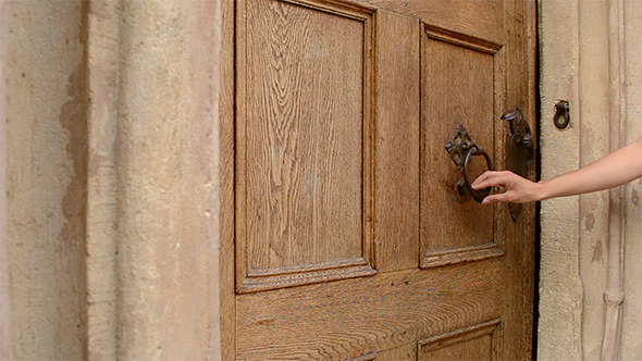 Woman Uses Door Knocker Woman Uses Door Knocker
