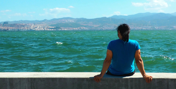 Man Sits Near The Seaside Man Sits Near The Seaside