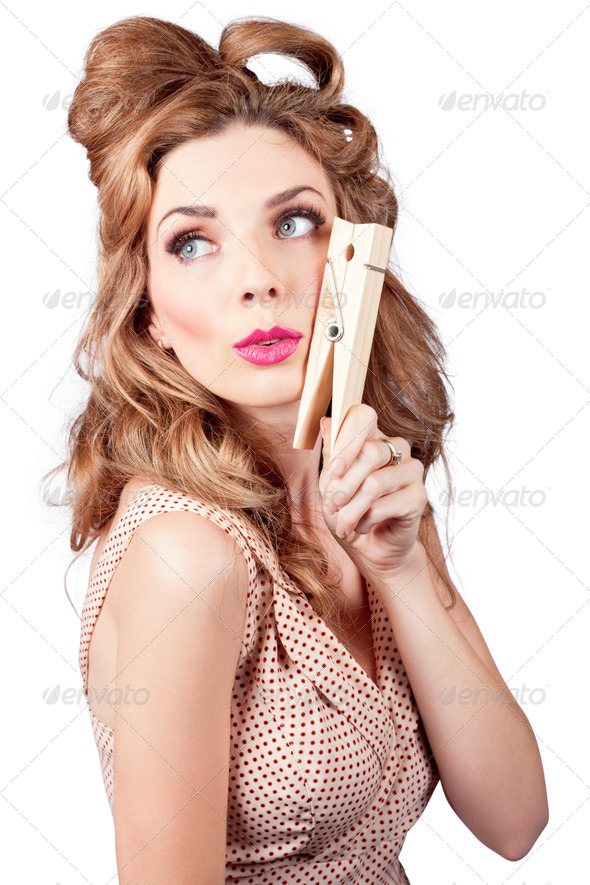 Pretty pinup housewife hanging out washing load - Stock Photo - Images