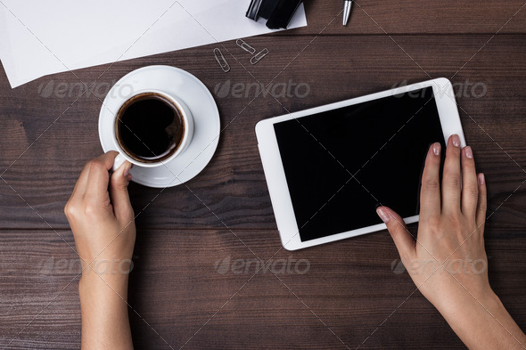 Women Hands With Tablet Computer And Coffee On Table