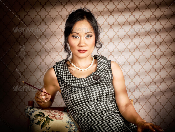 Stylish vintage asian pin-up lady with cigarette - Stock Photo - Images
