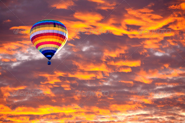 Balloon on Sunset / sunrise with clouds, light rays and other at