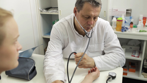 Doctor Measures The Blood Pressure Doctor Measures The Blood Pressure