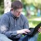 Man Working With Notebook In The Park - 27