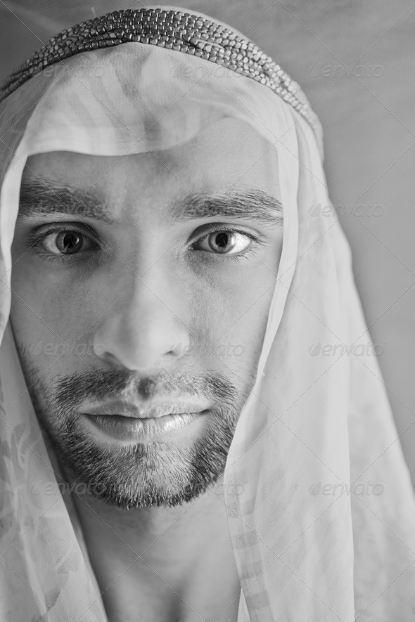 Portrait of a young man in the Arabian headscarf