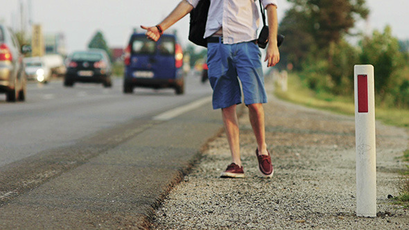 Male Hitchhiker on Busy Road 1 Male Hitchhiker on Busy Road 1