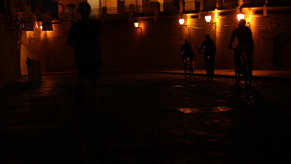 Cyclists Ride in Old Town Cyclists Ride in Old Town