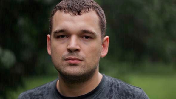 Young Man Under the Rain Young Man Under the Rain