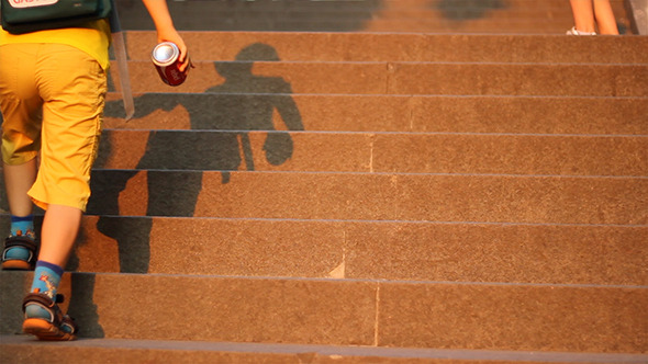Kid Playing with Shaddow on Stairs Kid Playing with Shaddow on Stairs