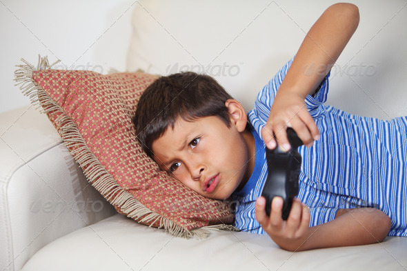 Young boy playing computer game