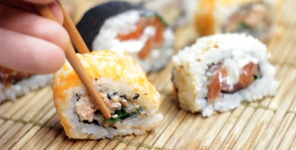 Eating Japanese Sushi Rolls Eating Japanese Sushi Rolls