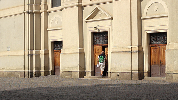 Man with Bagpack Enters Church Man with Bagpack Enters Church