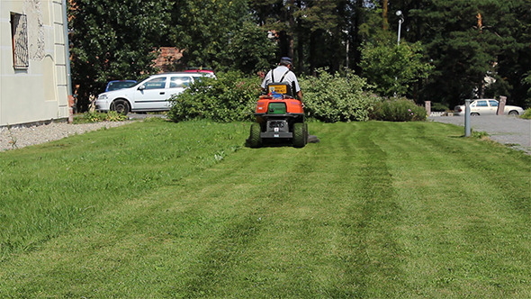 Gardener Mowing the Lawn Gardener Mowing the Lawn