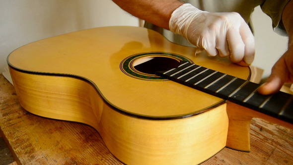 Luthier Varnishing Guitar Luthier Varnishing Guitar