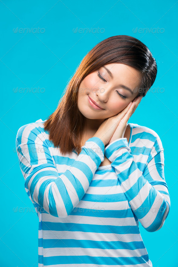 Portrait of a sleepy Asian Woman.