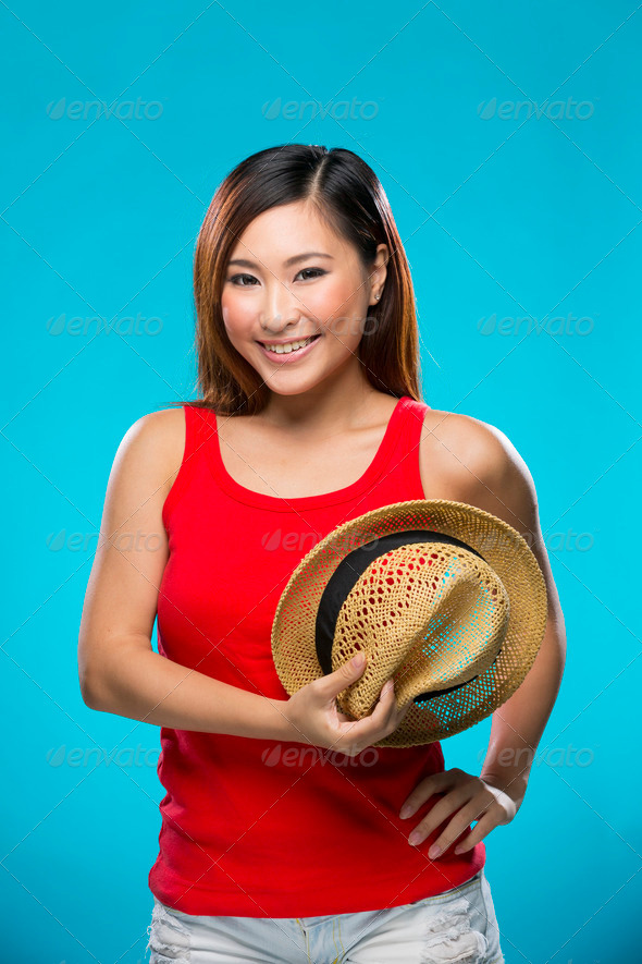 Fashionable Asian Woman wearing straw hat.