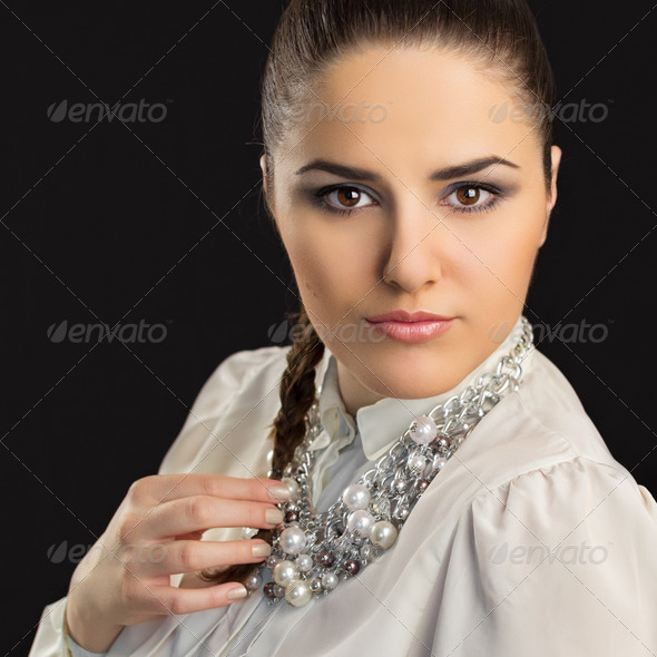 Gorgeous young stylish woman wearing modern necklace with pearls - Stock Photo - Images