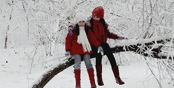 Girls Talking on a Tree in Winter Girls Talking on a Tree in Winter