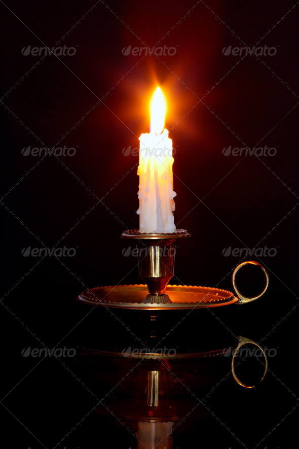Candle in brass chamberstick