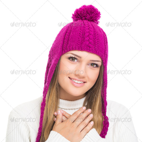 Cute teenage girl wearing pink knitted hat - Stock Photo - Images