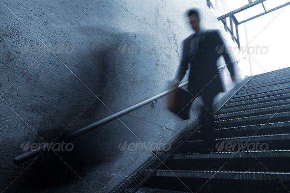 Busy Businessman Rushing Down the Stairs