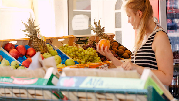 Young Woman Shopping For Fresh Fruit Young Woman Shopping For Fresh Fruit