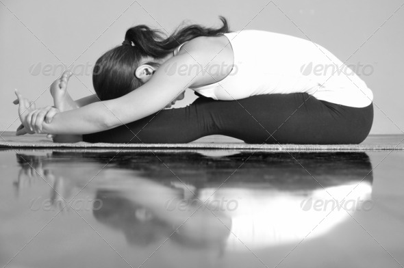 Girl doing Paschimottanasana yoga pose