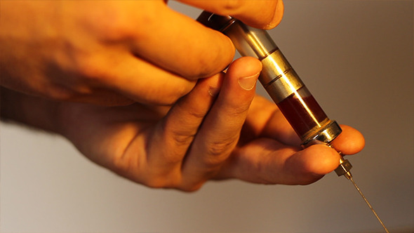 Using Vintage Blood Syringe Using Vintage Blood Syringe