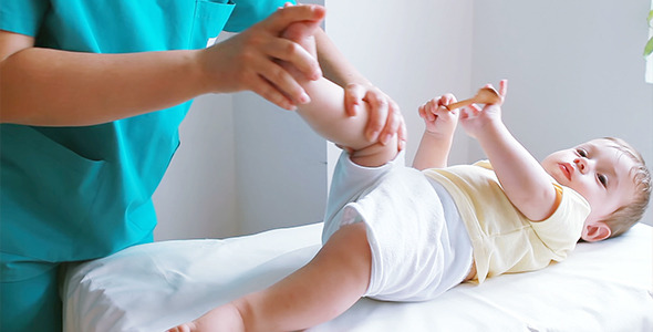 Physiotherapist Massaging Baby Boy Foot 1 Physiotherapist Massaging Baby Boy Foot 1