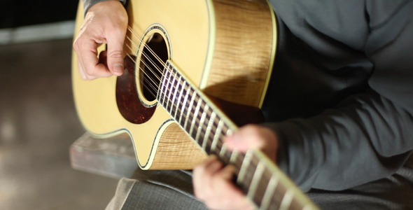 Guitarist Playing a 12 String Acoustic Guitarist Playing a 12 String Acoustic